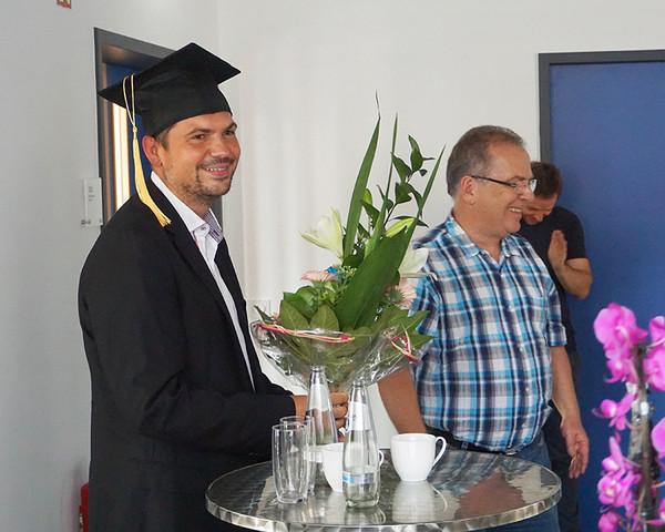 Dr. Daniel Herfert with doctor hat and Dr.Weckend